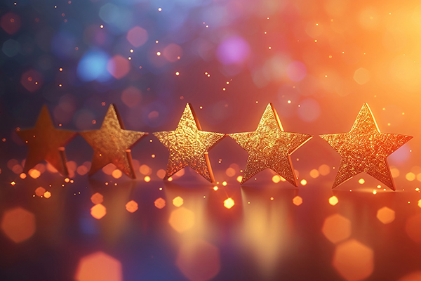 Goldene Sterne vor einem funkelnden blau-goldenen Hintergrund